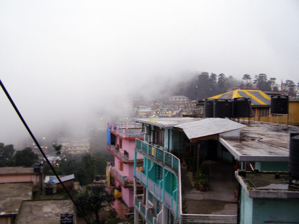 Fog swallows Mcleod Ganj whole. Fog cover all city.