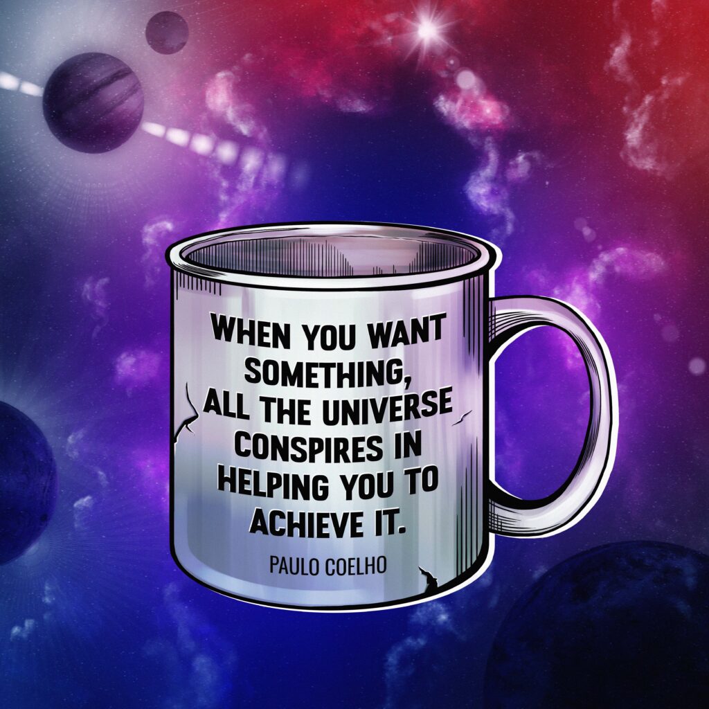 A comic-style enamel mug floating in colorful outer space, surrounded by planets and nebulae. The mug features a quote by Paulo Coelho: “When you want something, all the universe conspires in helping you to achieve it.”
